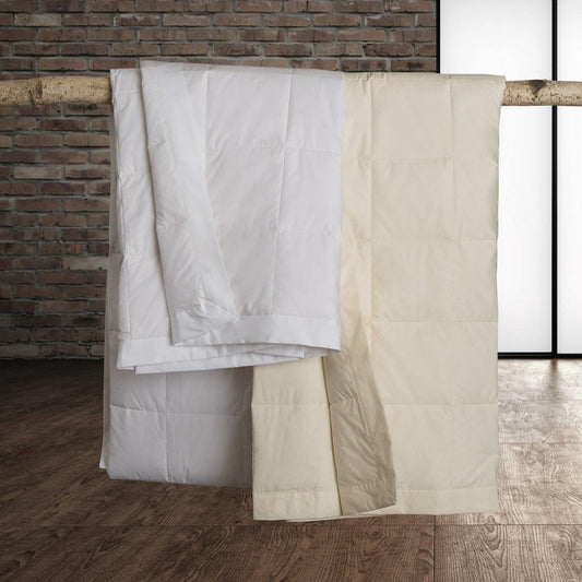 Classic Down Blanket by Downright, styled on a bed
