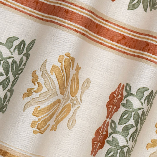 Folkloric Floral Stripe Printed Linen Fabric by Volga Linen in Amber/Oyster, rippled to show the drape