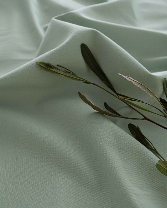 Green Tea fabric by Coordonné in 668, shown in a styled room