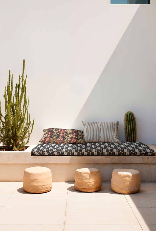 Llengües fabric by Coordonné in Black, shown in a styled room