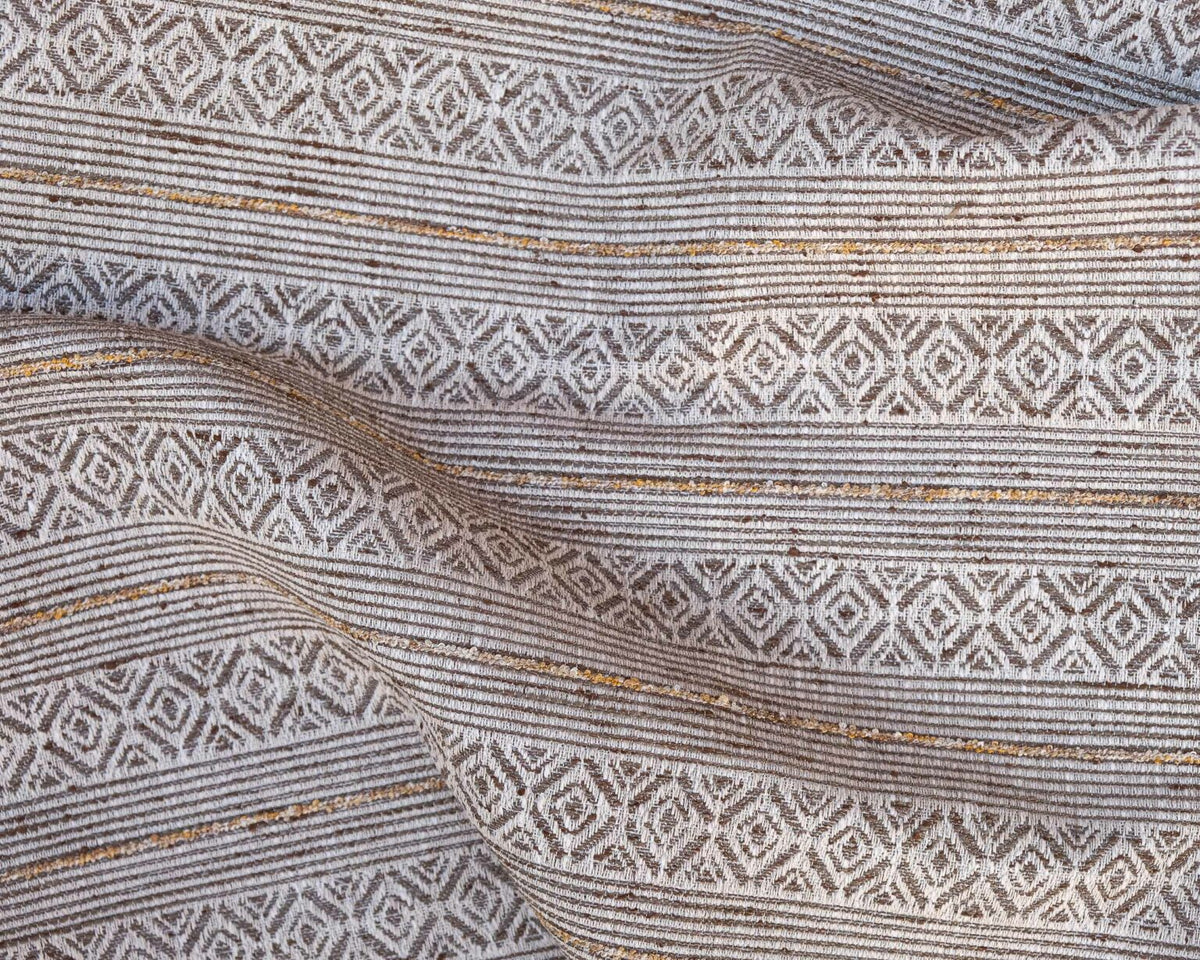 Bandolero fabric by Coordonné in Plata, shown in a styled room