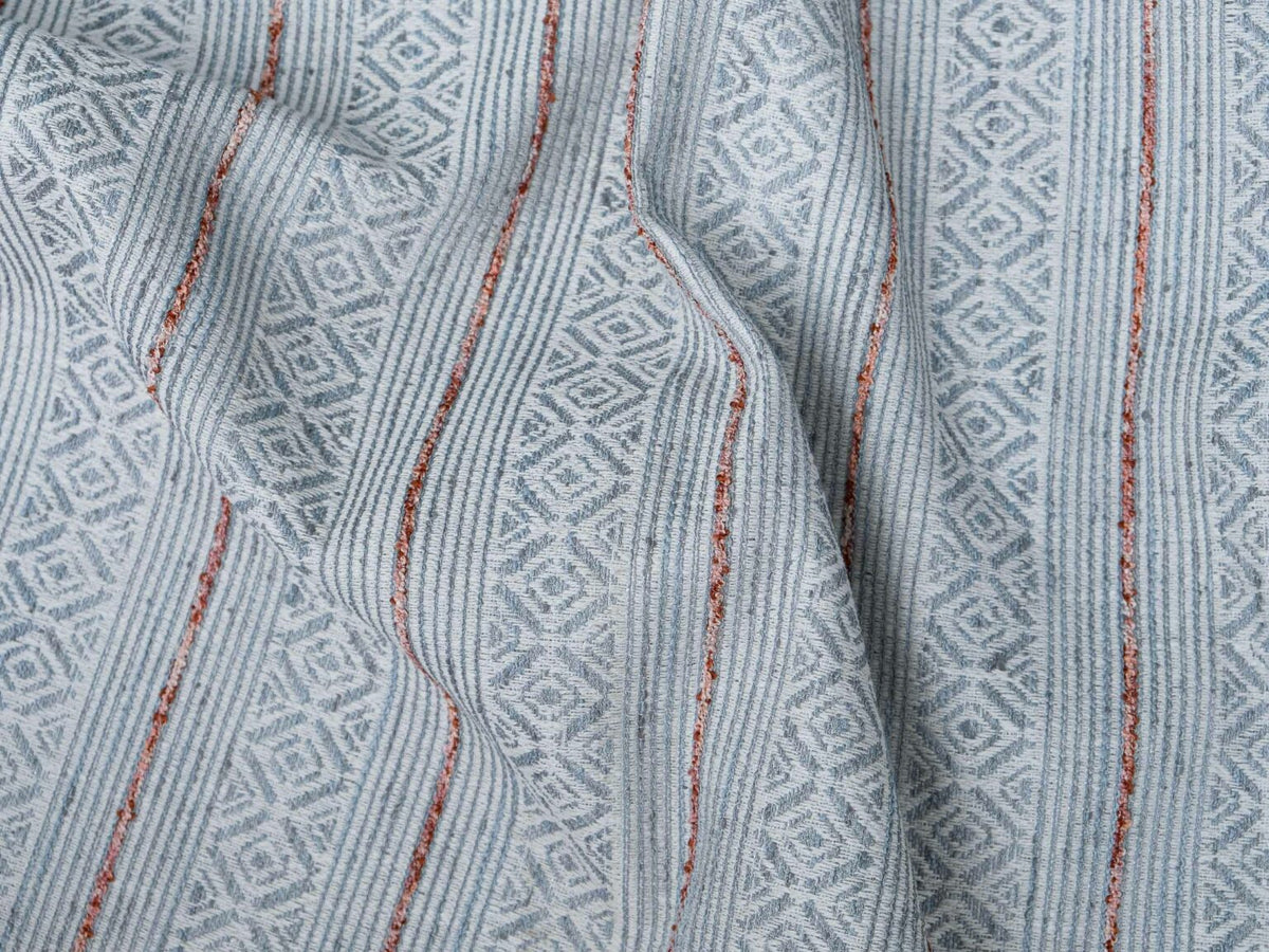 Bandolero fabric by Coordonné in Rosado, shown in a styled room