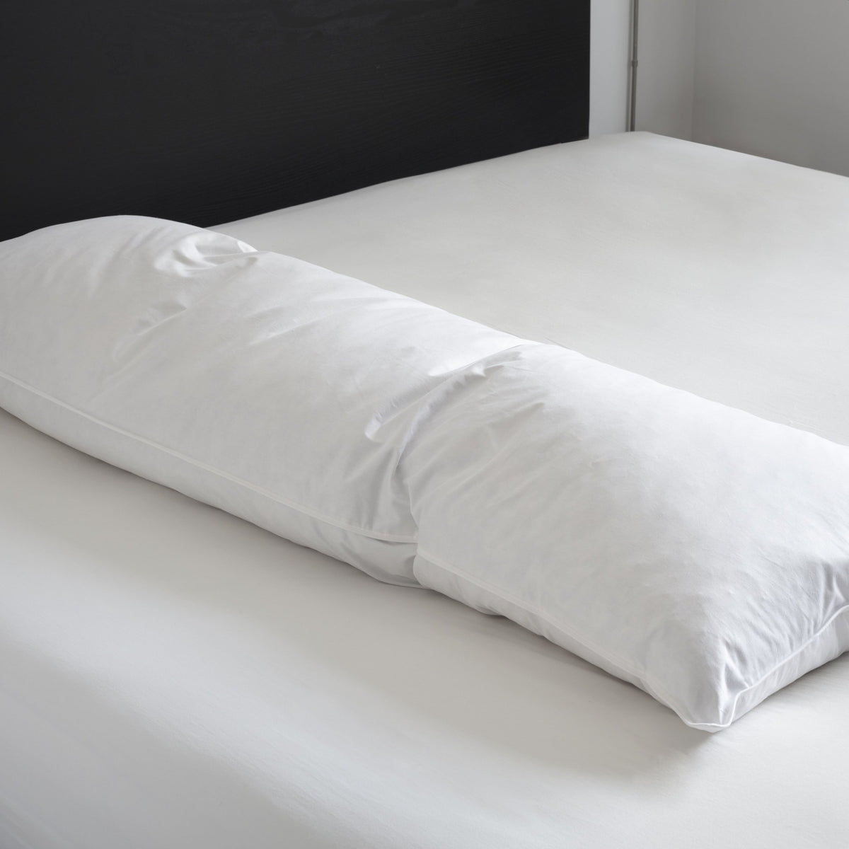Body Pillow by Downright, styled on a bed