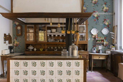 Carmen wallpaper by Coordonné in Celadón, shown in a styled room
