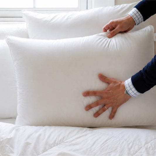 Centera Dual-Core Down Pillow by Downright, styled on a bed