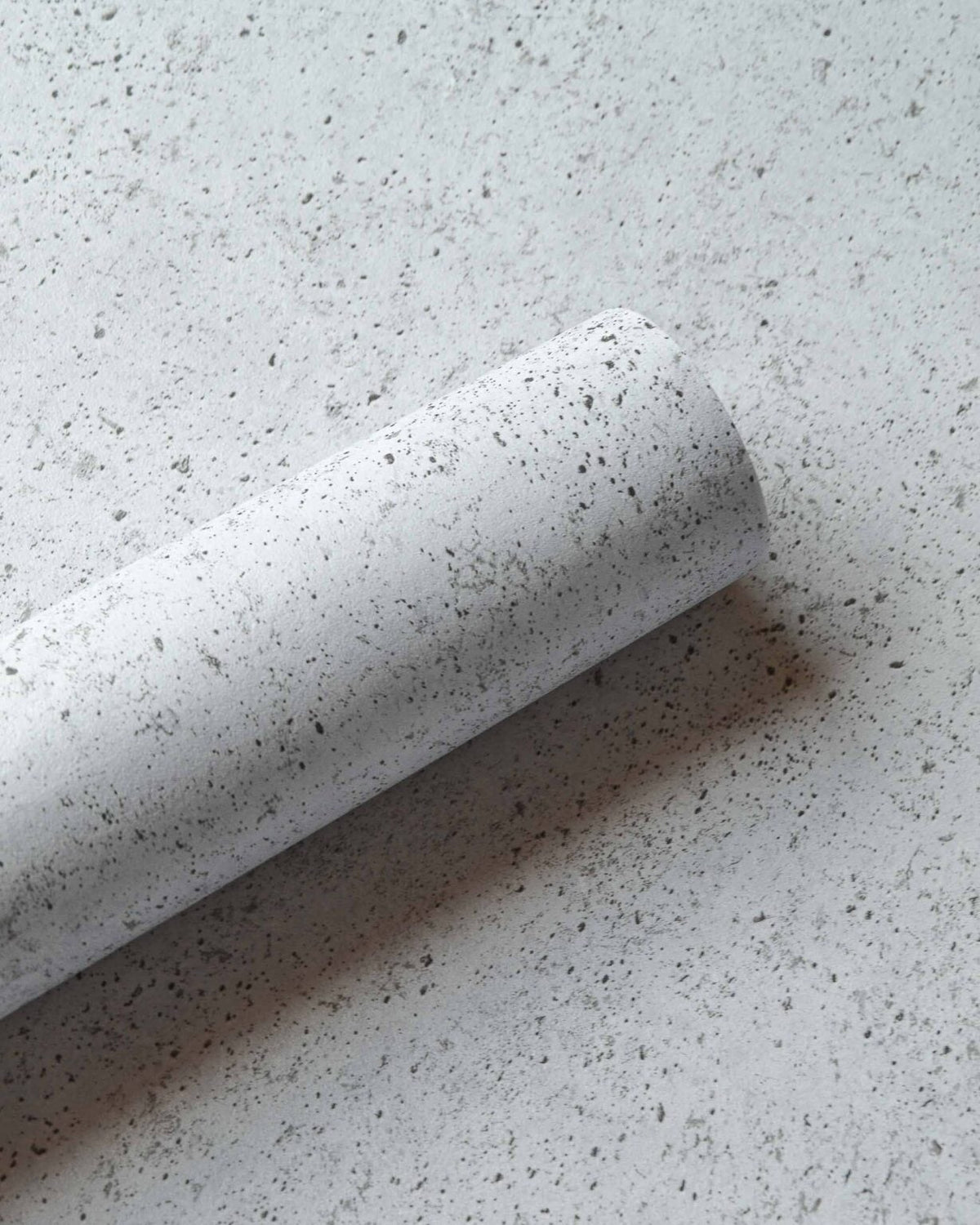 Ciment wallpaper by Coordonné in Glacier, shown in a styled room