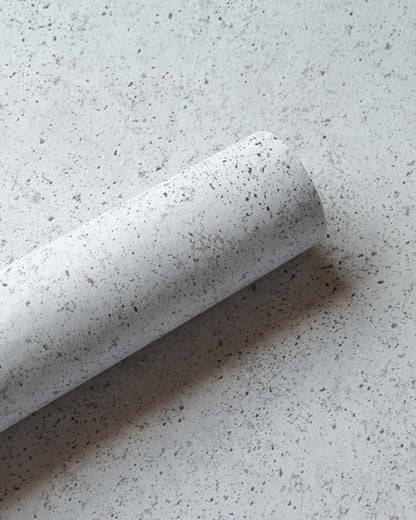 Ciment wallpaper by Coordonné in Glacier, shown in a styled room