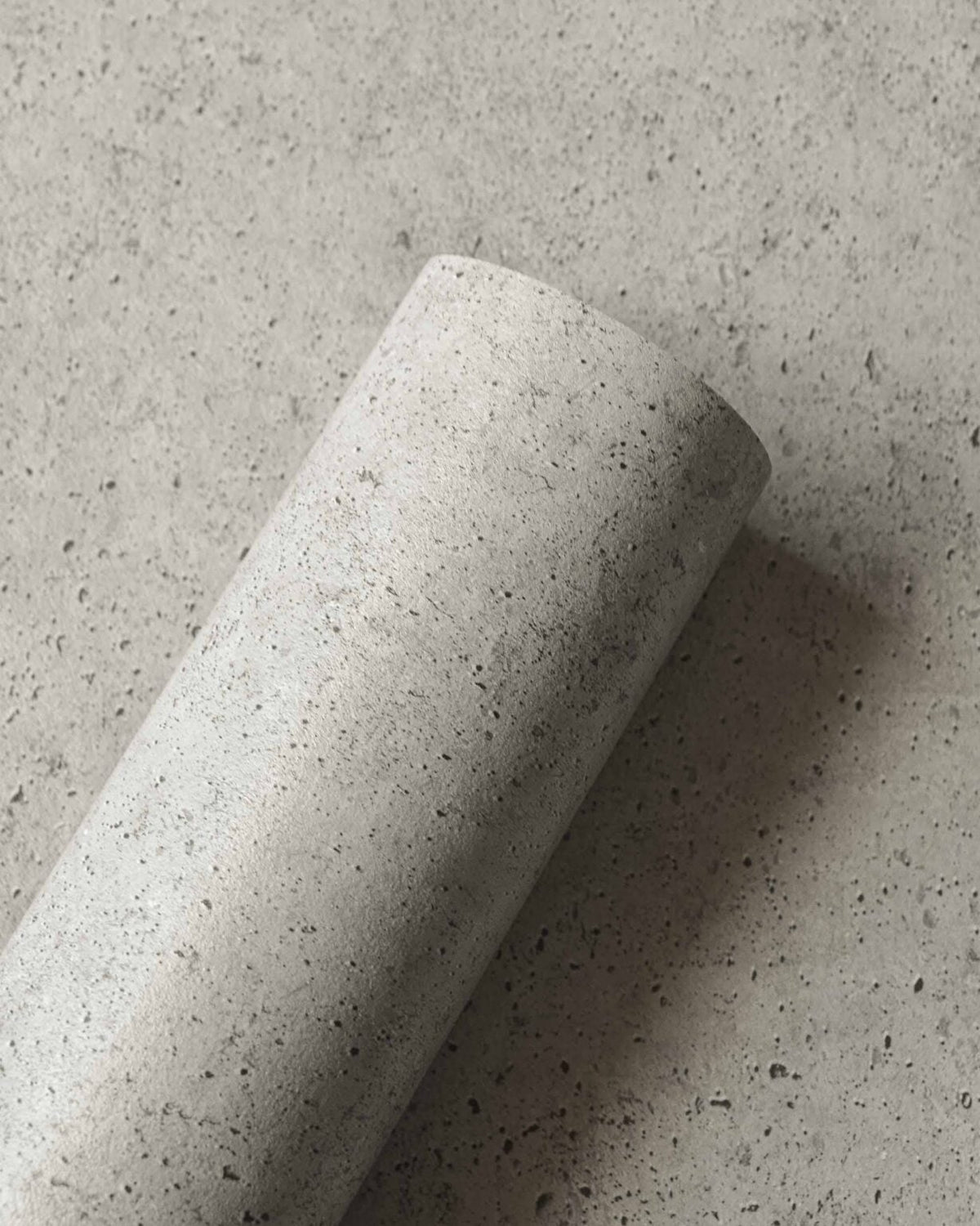 Ciment wallpaper by Coordonné in Taupe, shown in a styled room
