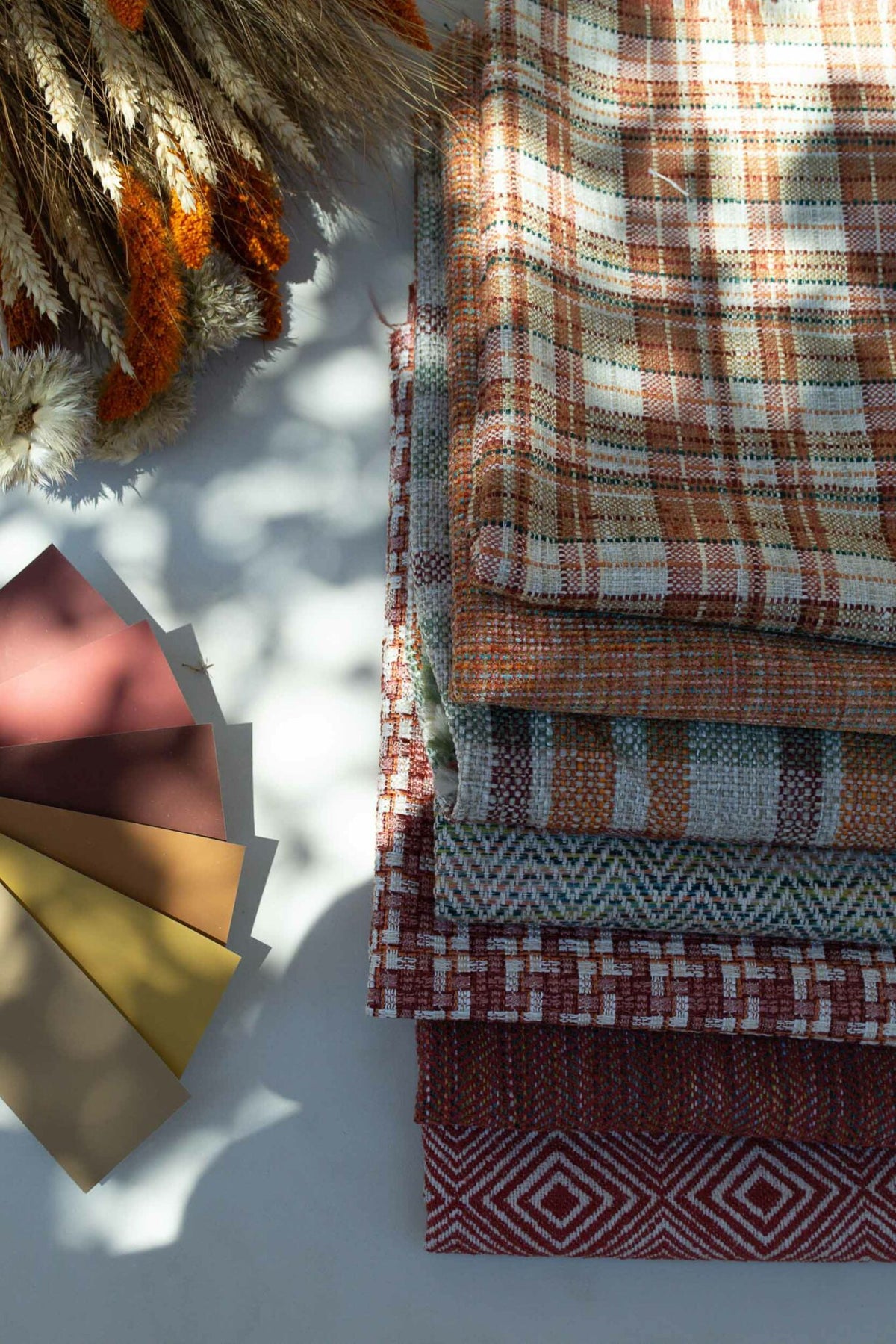 Coat fabric by Coordonné in Clay, shown in a styled room