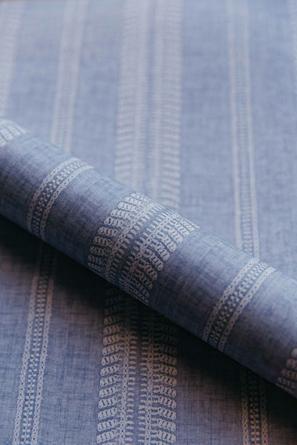Costura wallpaper by Coordonné in Ceruleo, shown in a styled room