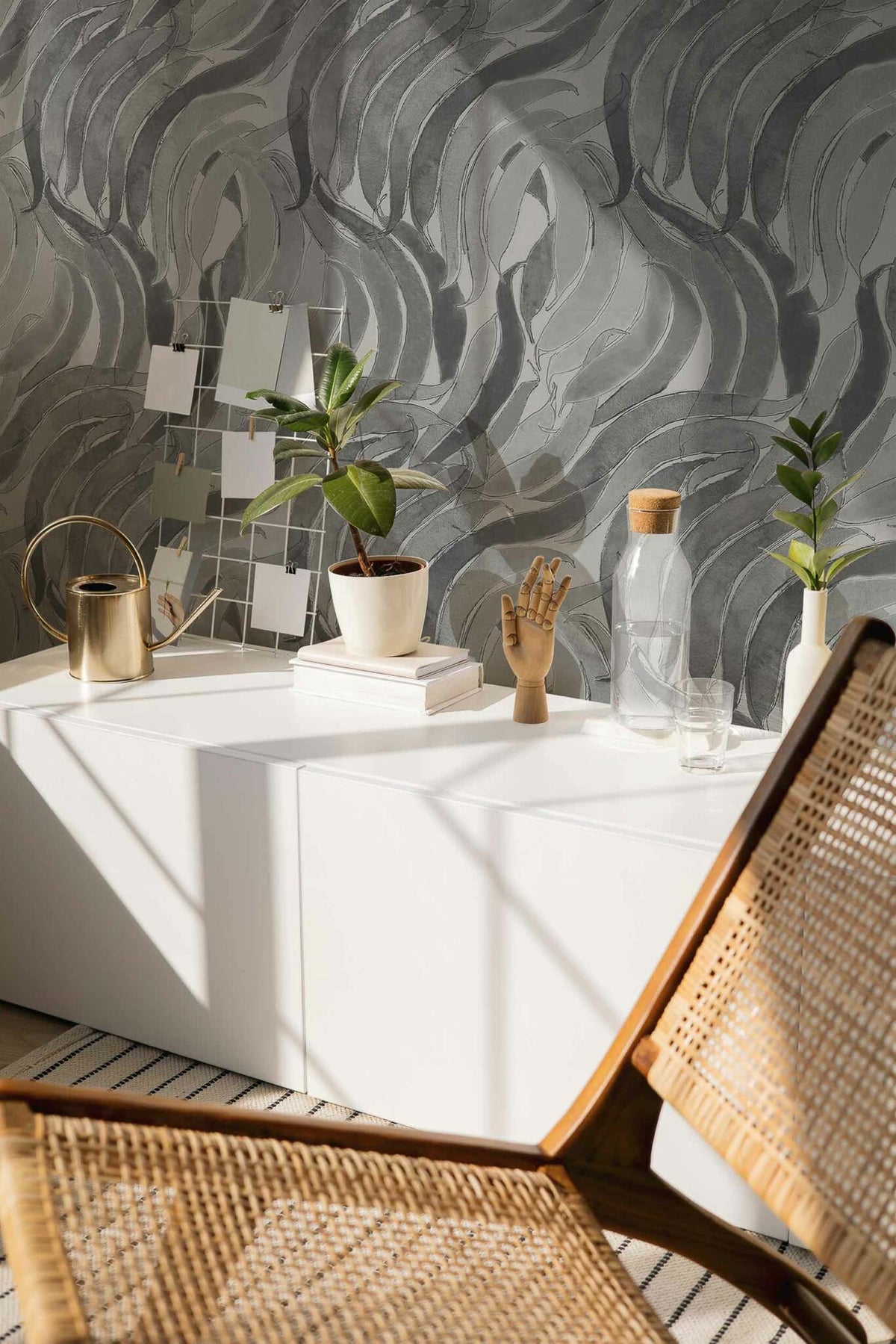 Crop Fossils wallpaper by Coordonné in Onyx, shown in a styled room