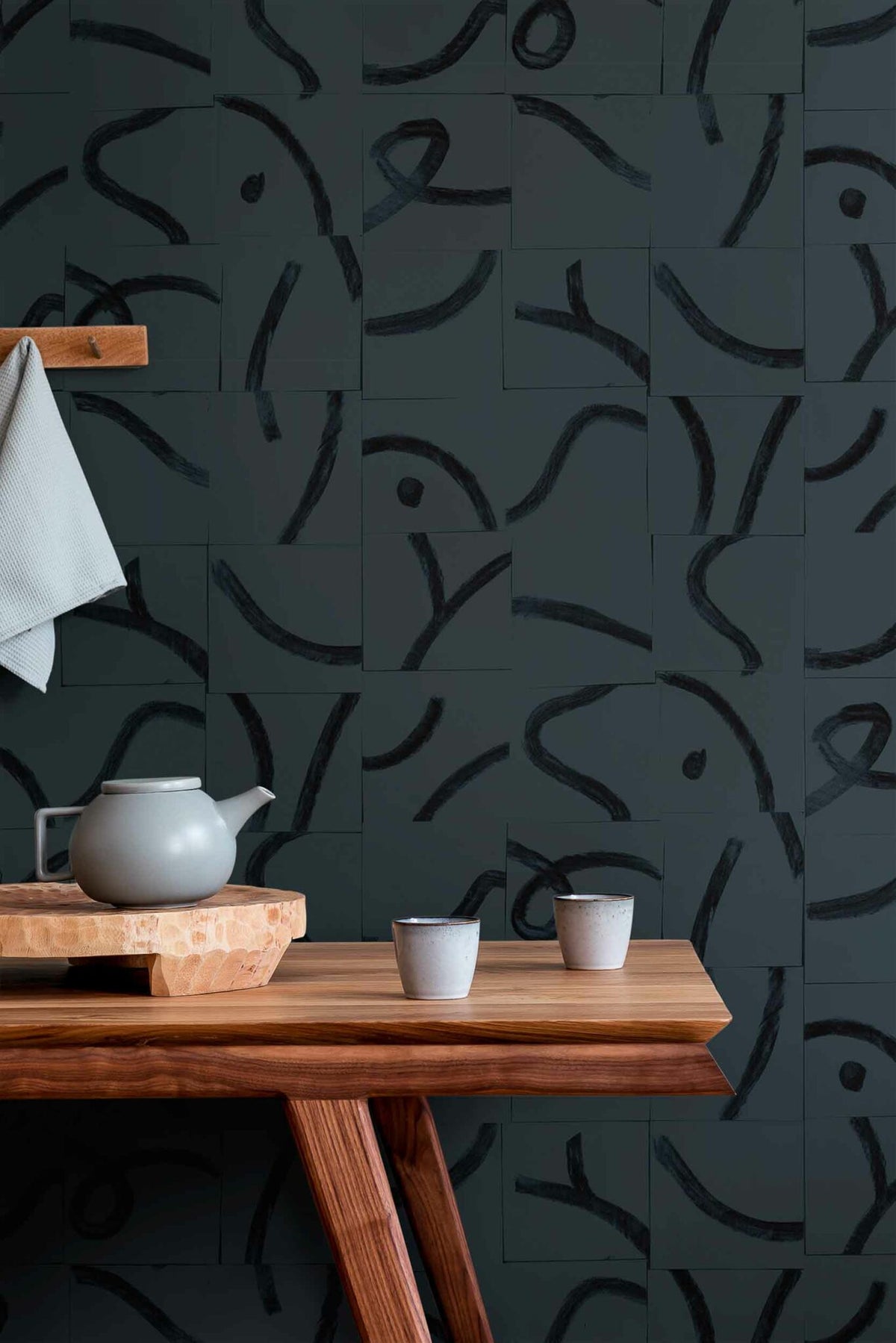 Cubic Routes wallpaper by Coordonné in Antracite, shown in a styled room