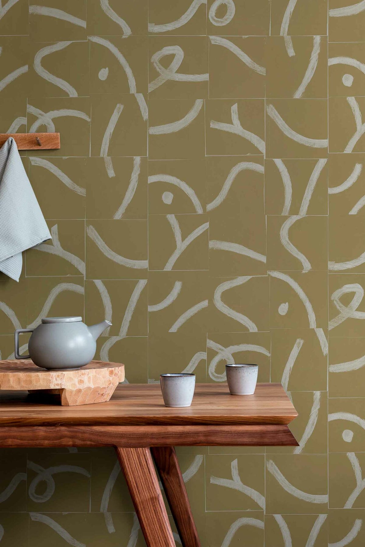 Cubic Routes wallpaper by Coordonné in Dune, shown in a styled room