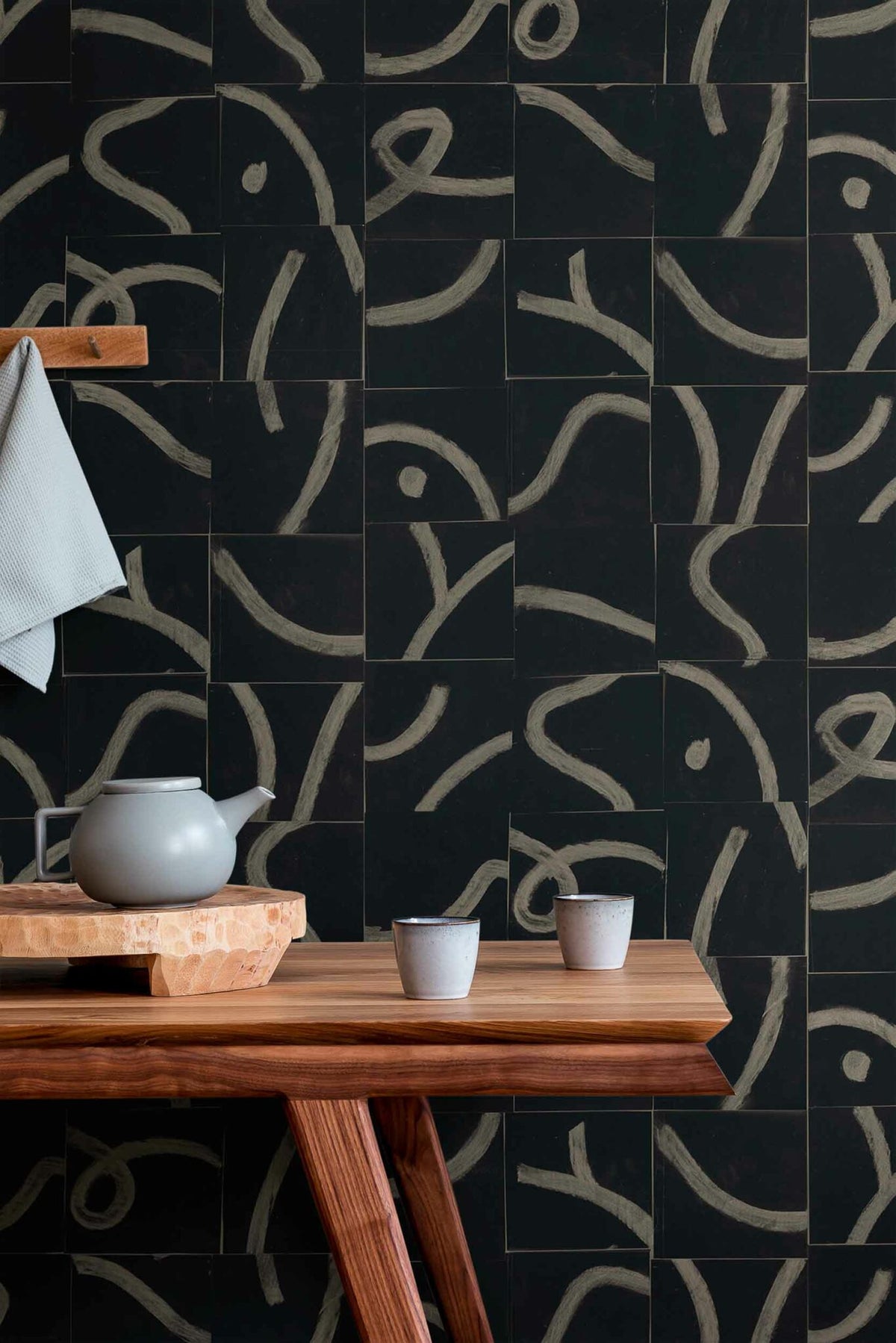 Cubic Routes wallpaper by Coordonné in Onyx, shown in a styled room