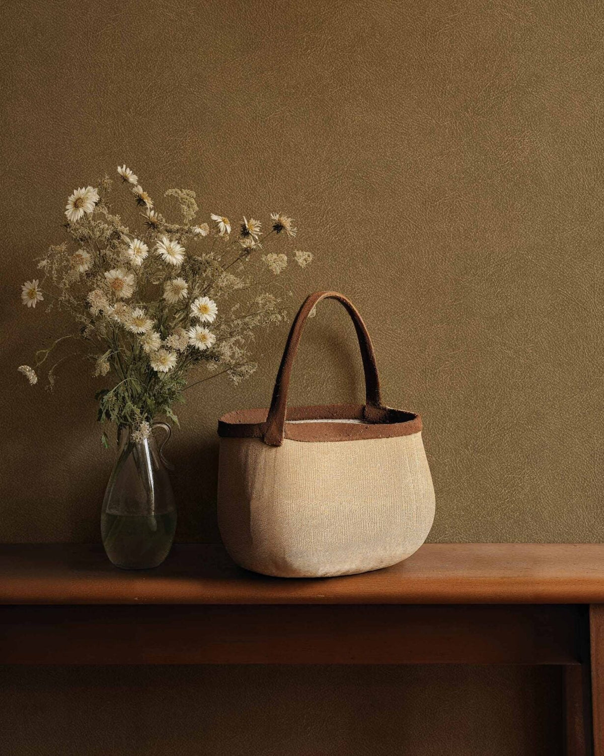 Cuero wallpaper by Coordonné in 22, shown in a styled room