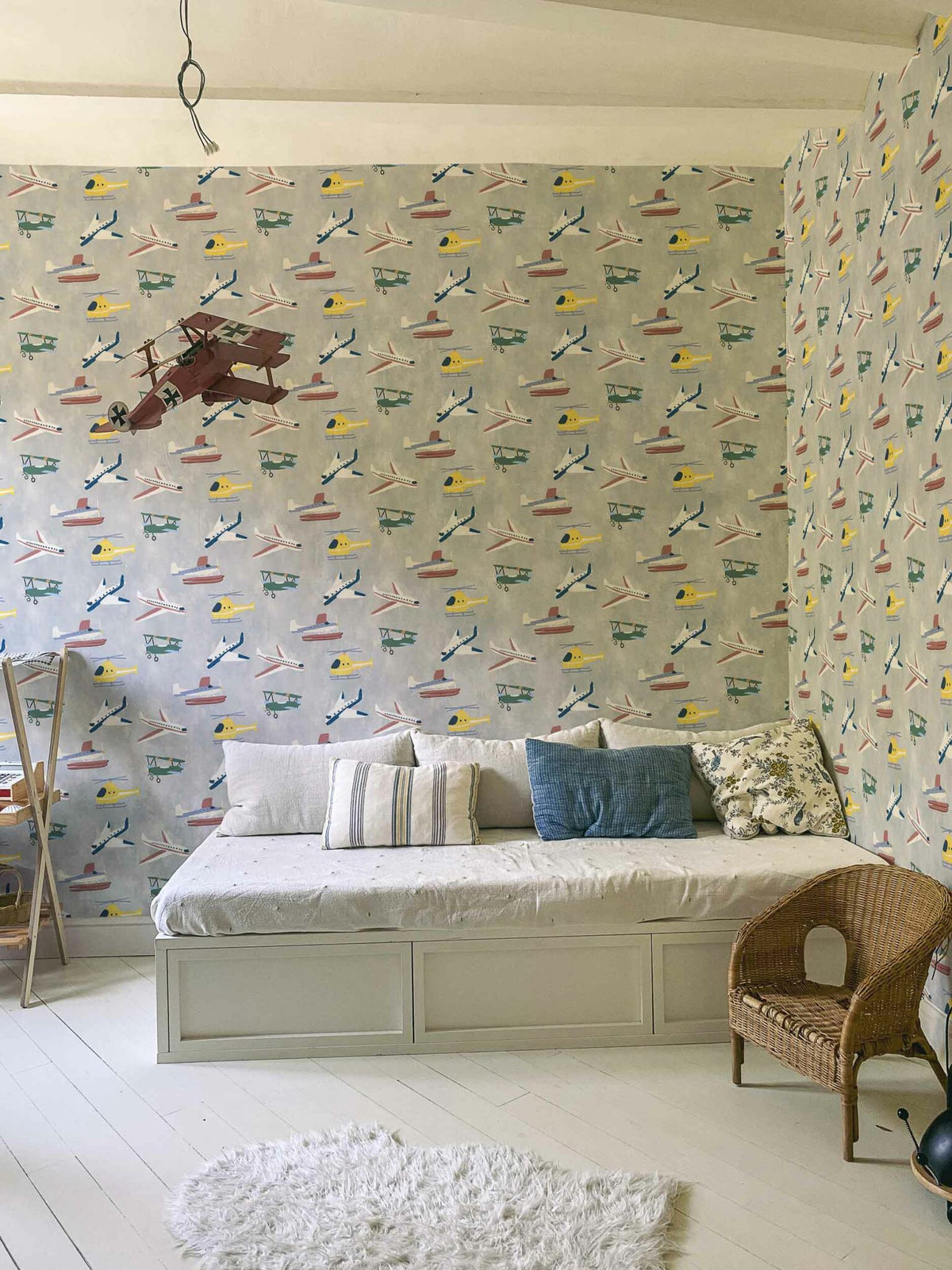 Draft Planes wallpaper by Coordonné in Cloud, shown in a styled room