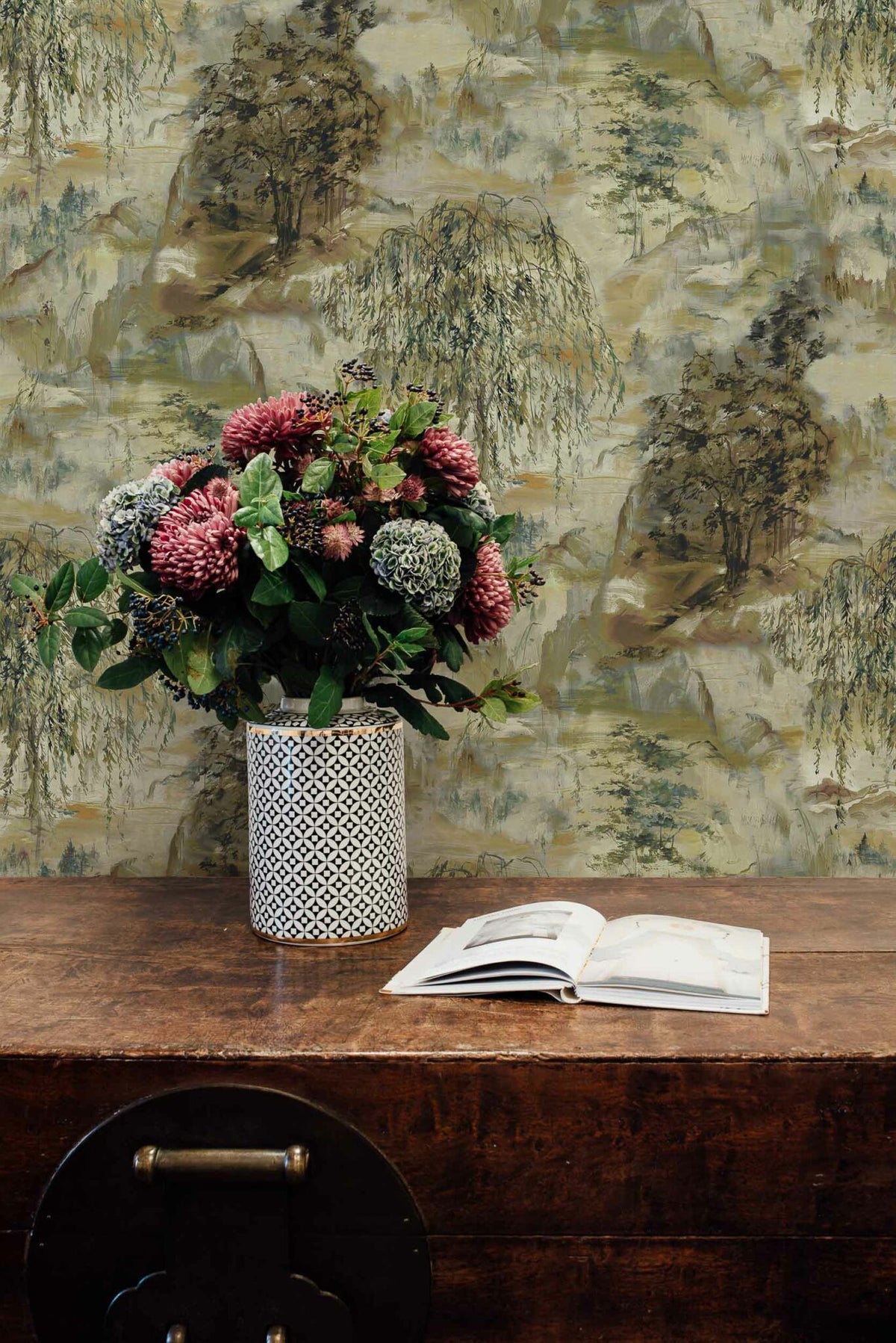 Dunhuang wallpaper by Coordonné in Cardamom, shown in a styled room