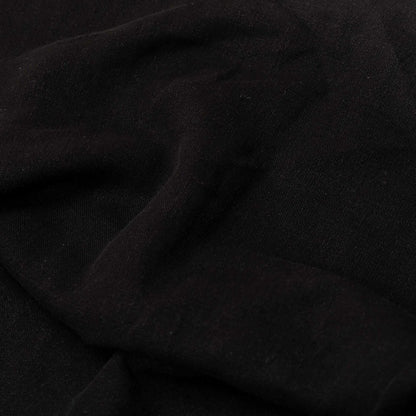 El Mercader fabric by Coordonné in Black, shown in a styled room