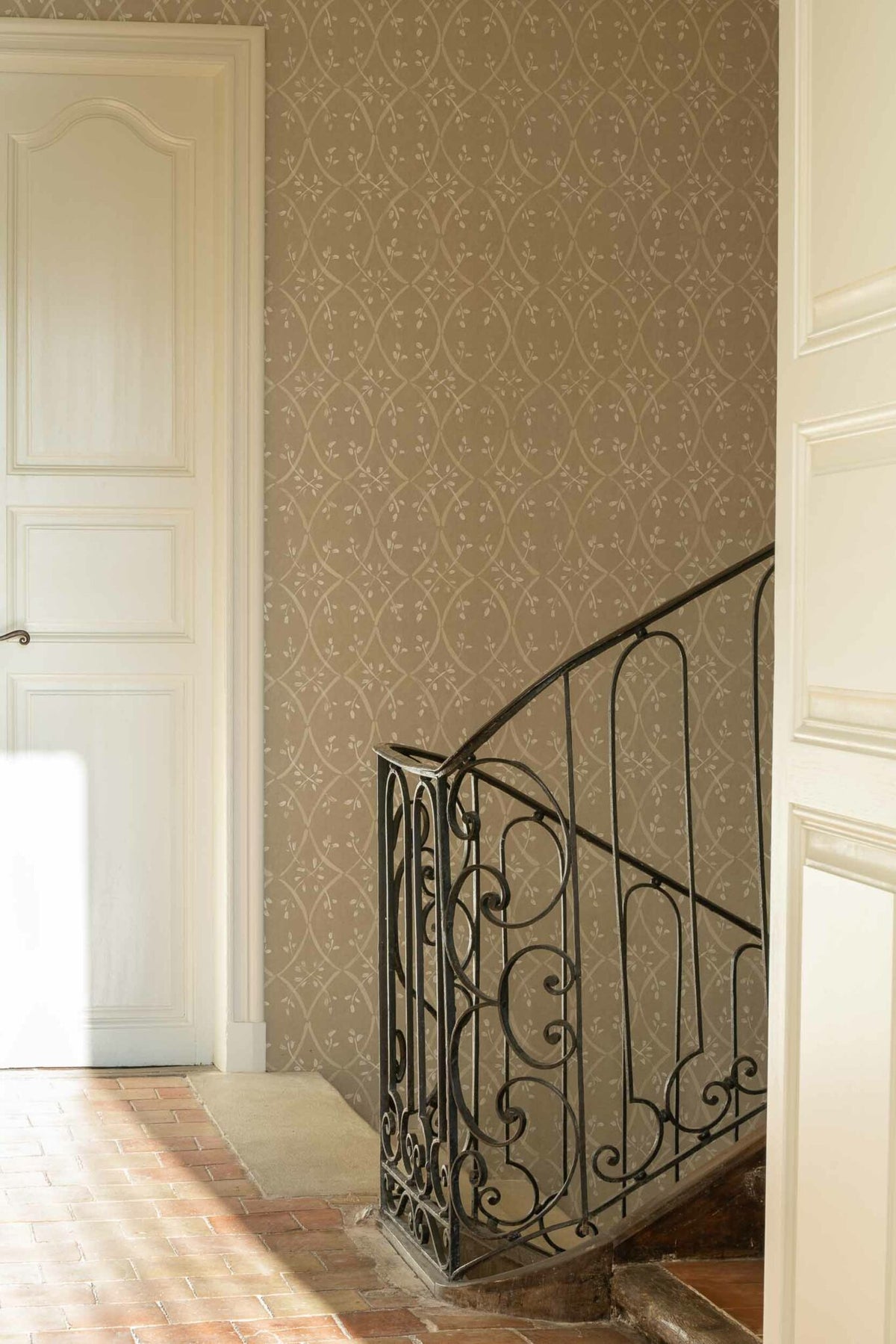 Forja wallpaper by Coordonné in Papiro, shown in a styled room