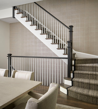 Framed Wallpaper by Phillip Jeffries in Brilliant Silver, shown installed in a room setting