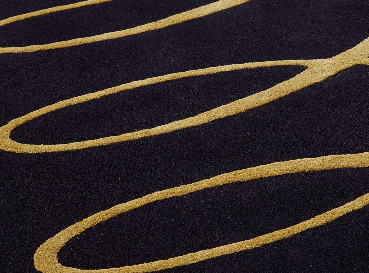Gotham Tuft Rug by Pierre Frey shown in a room setting (view 1)