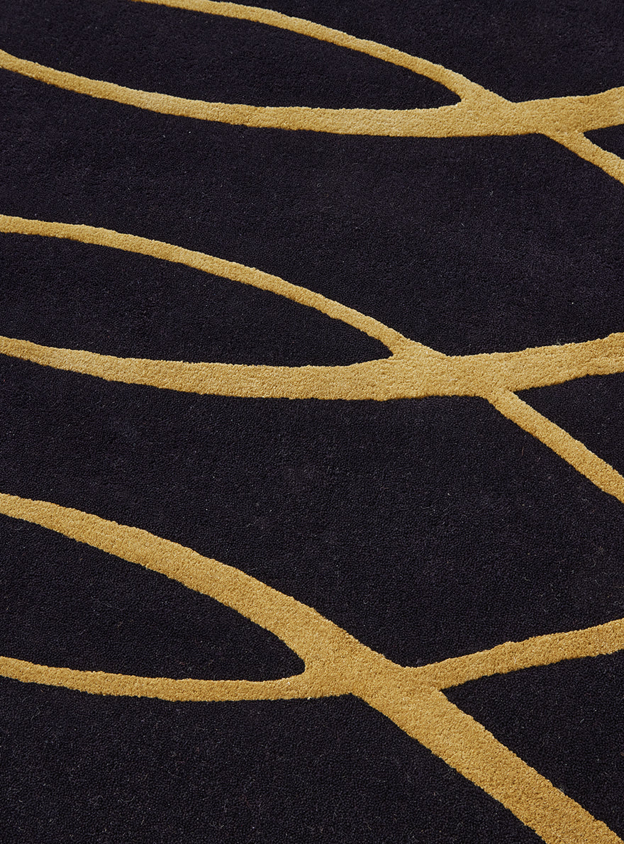 Gotham Tuft Rug by Pierre Frey shown in a room setting (view 2)