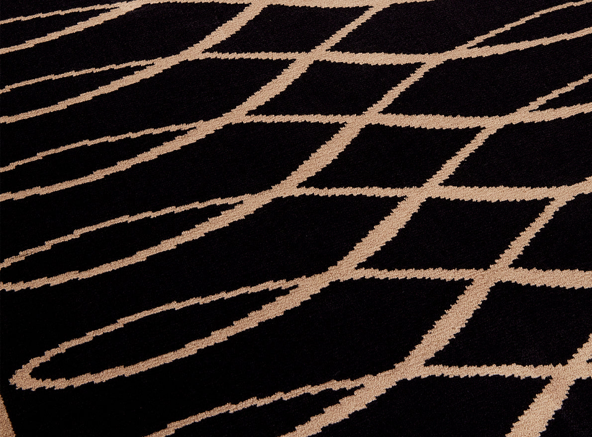 Gotham Wilton Rug by Pierre Frey shown in a room setting (view 1)