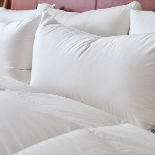 Intera Dual-Core Goose Down Pillow by Downright, styled on a bed