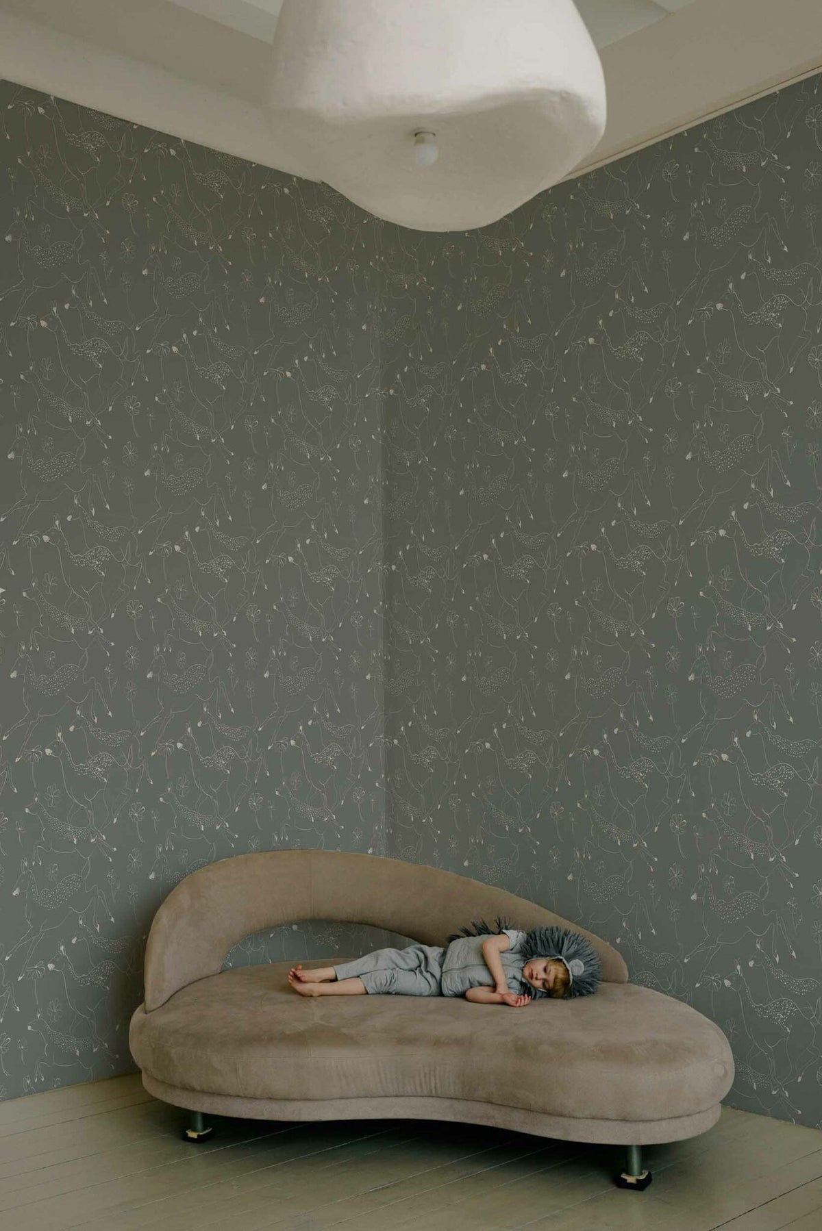 Jumping Bambis wallpaper by Coordonné in Cloud, shown in a styled room