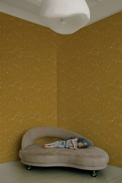 Jumping Bambis wallpaper by Coordonné in Curry, shown in a styled room