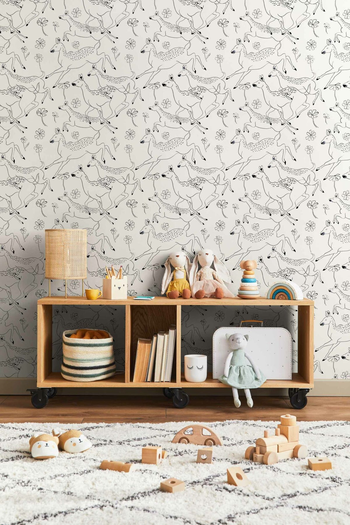 Jumping Bambis wallpaper by Coordonné in Linen, shown in a styled room