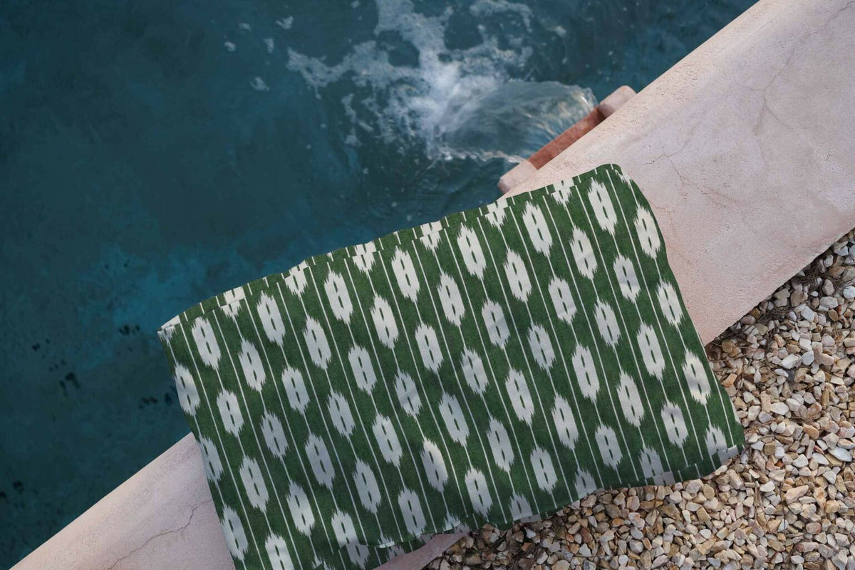 Llengües fabric by Coordonné in Green, shown in a styled room