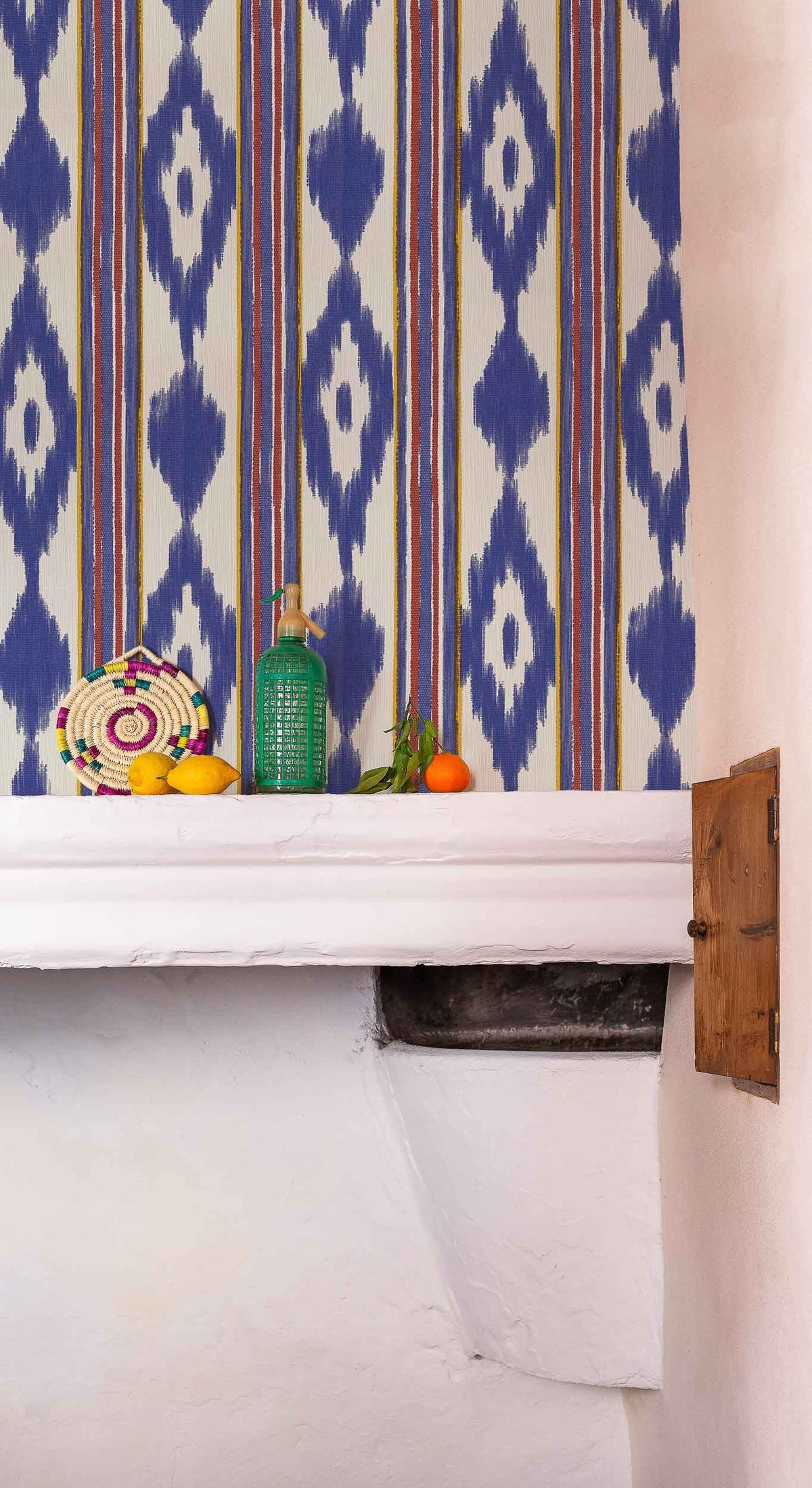 Lloseta wallpaper by Coordonné in Indigo, shown in a styled room
