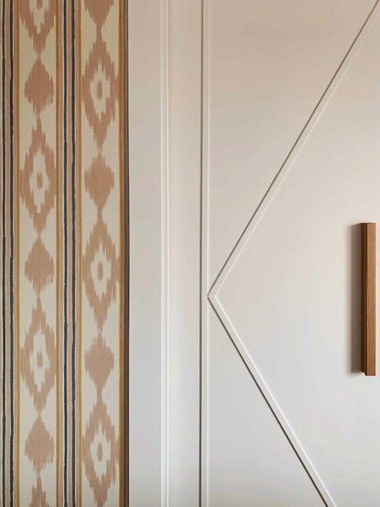 Lloseta wallpaper by Coordonné in Peach, shown in a styled room
