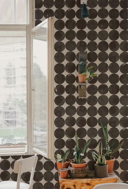 Luna Craters wallpaper by Coordonné in Onyx, shown in a styled room