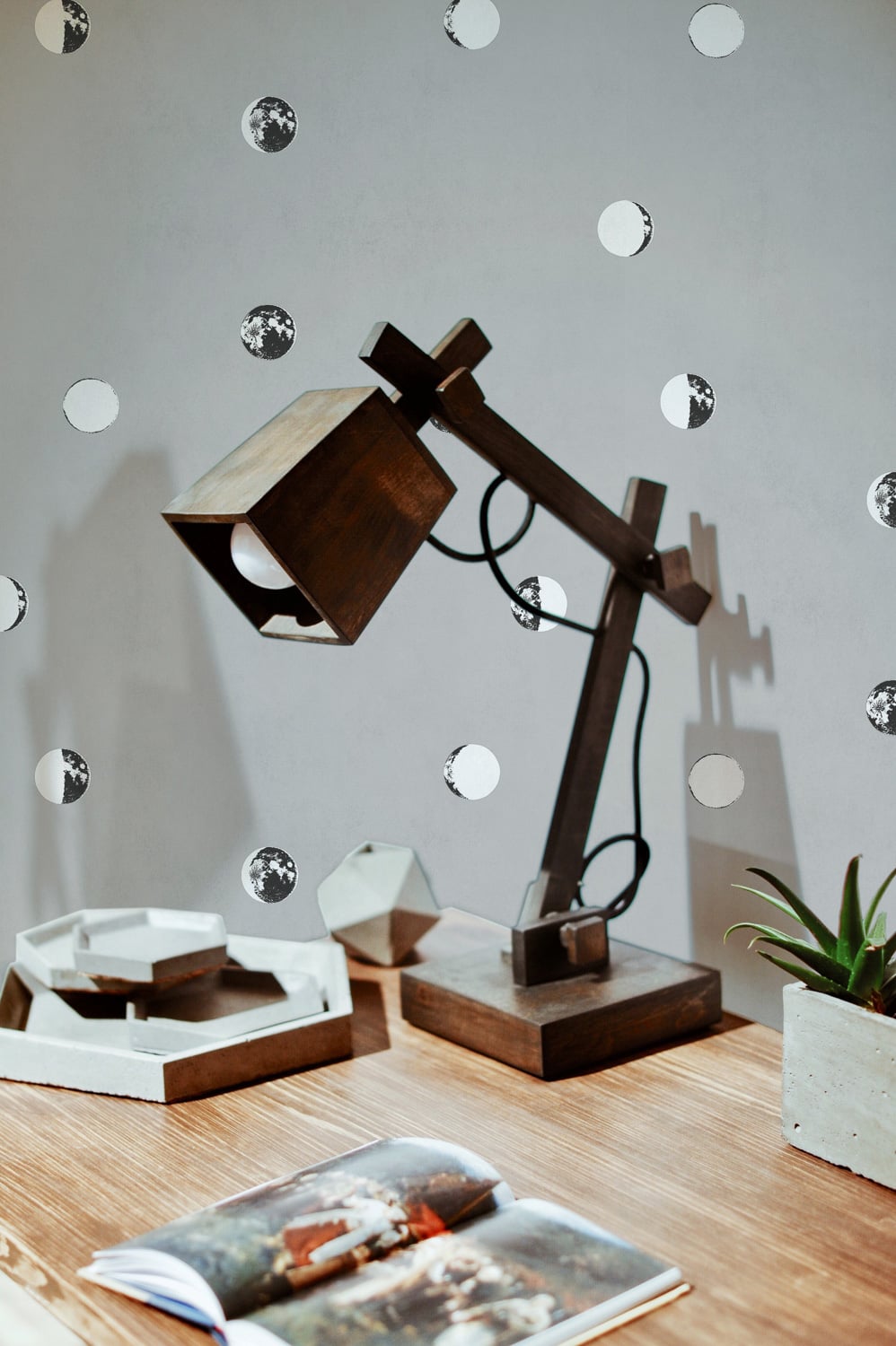 Lunatic wallpaper by Coordonné in Cherry, shown in a styled room