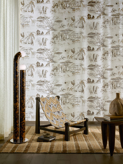 Masai Mara Wallpaper by Pierre Frey shown in a room setting (view 1)