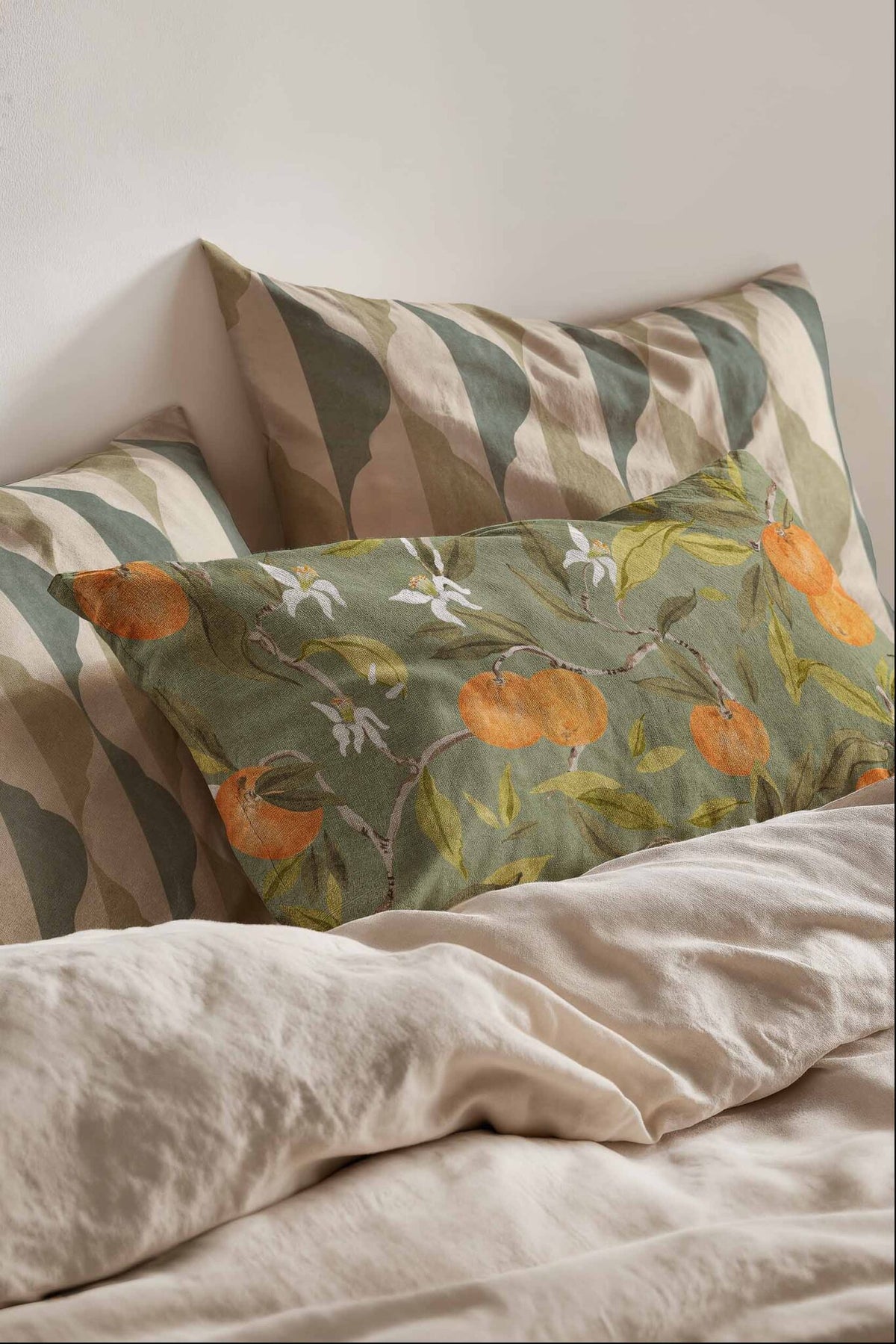 Naranjos fabric by Coordonné in Celadon, shown in a styled room