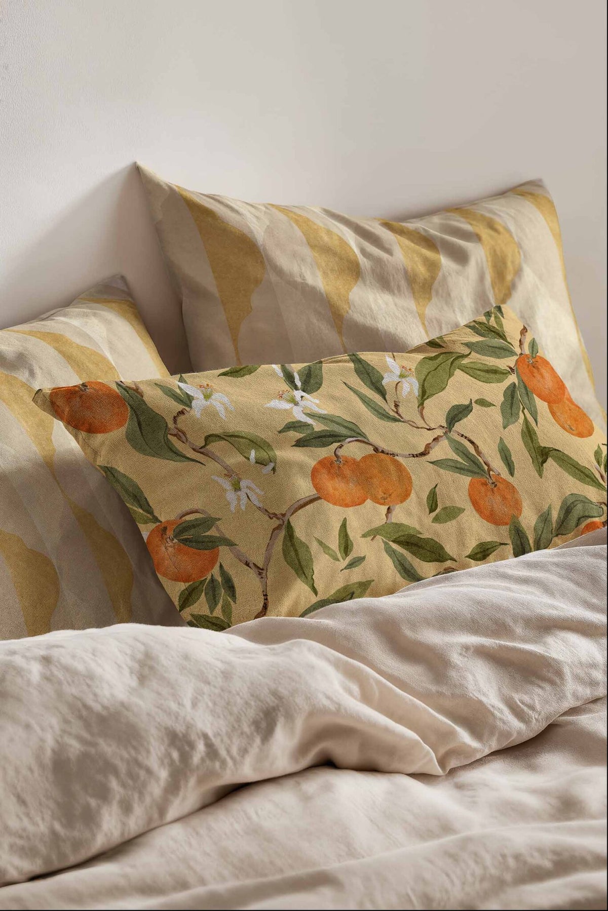 Naranjos fabric by Coordonné in Ocre, shown in a styled room