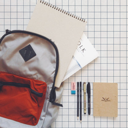 Notebook wallpaper by Coordonné in Navy, shown in a styled room