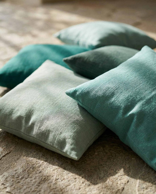 Oslo 140 fabric by Coordonné in Aqua, shown in a styled room