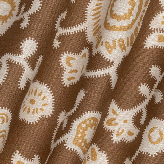 Persian Poppy Printed Linen Fabric by Volga Linen in Bronze/Natural, rippled to show the drape
