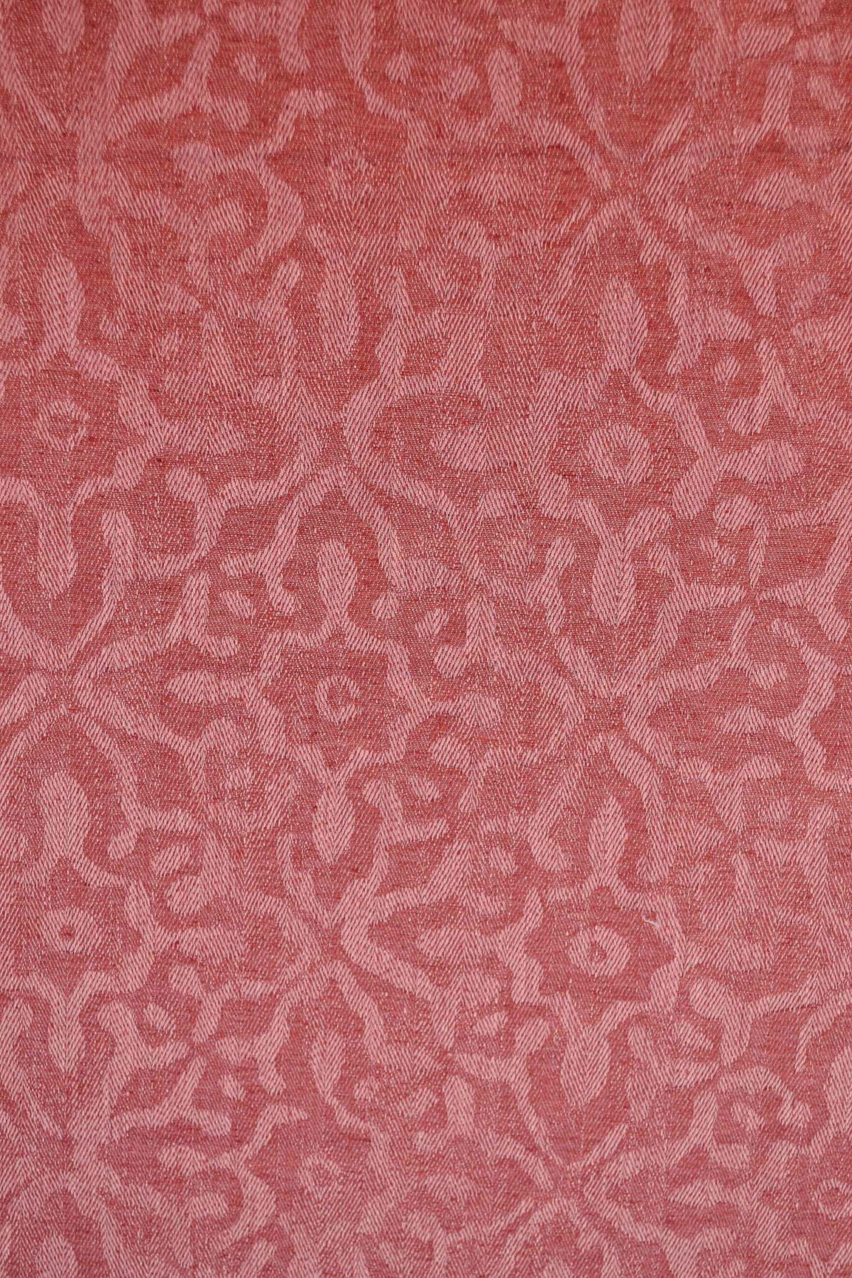 Phaistos fabric by Coordonné in Coral, shown in a styled room