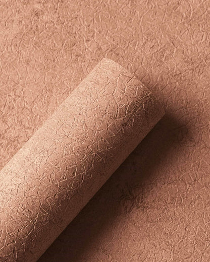 Riz wallpaper by Coordonné in Corail, shown in a styled room