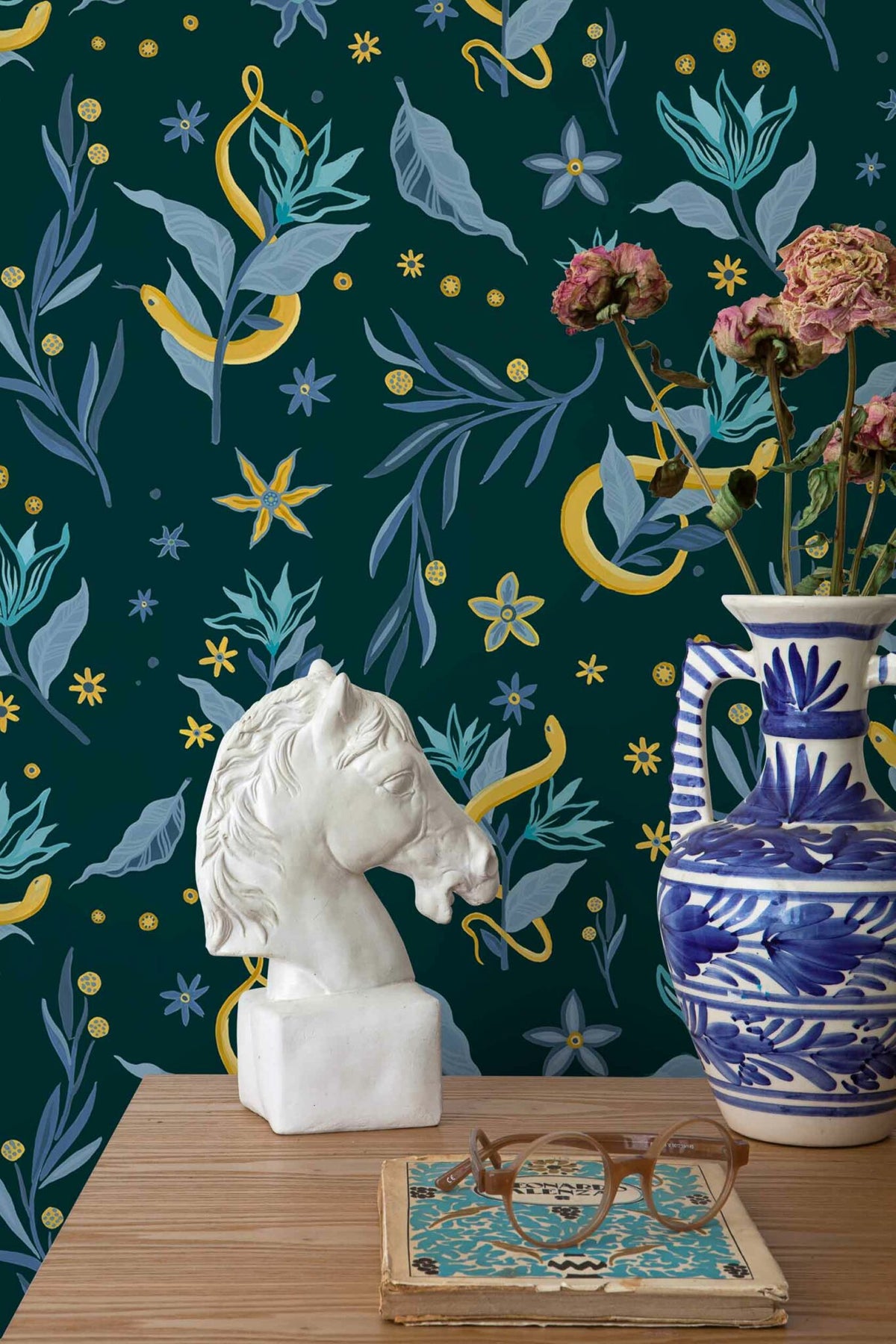 Serpientes y Flores wallpaper by Coordonné in Dark, shown in a styled room
