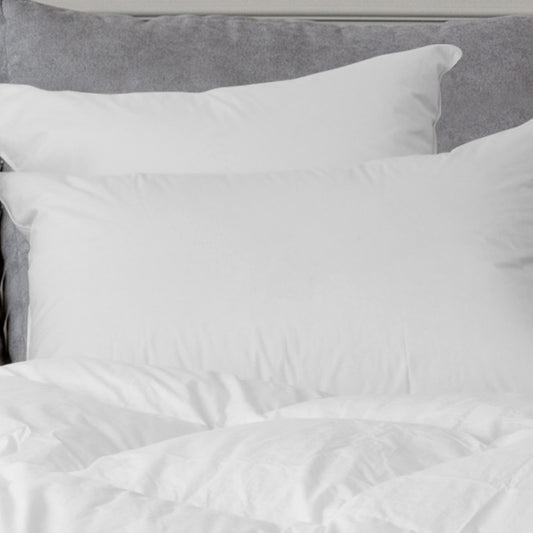 Sierra Down Alternative Pillow by Downright, styled on a bed