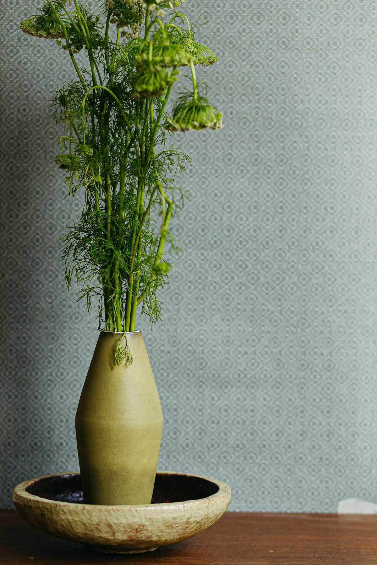 Sisal wallpaper by Coordonné in Celadón, shown in a styled room