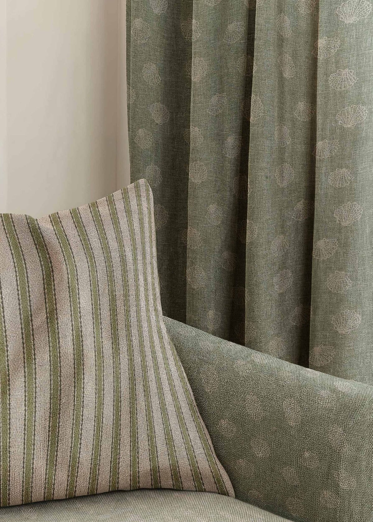 Sta Maria fabric by Coordonné in Musgo, shown in a styled room