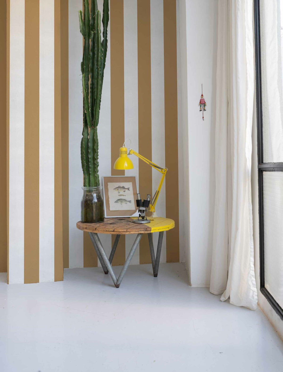 Stripe 8 wallpaper by Coordonné in Curry, shown in a styled room