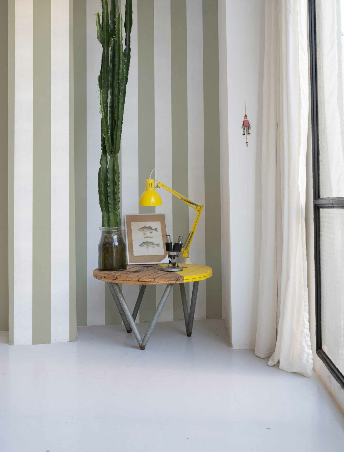 Stripe 8 wallpaper by Coordonné in Matcha, shown in a styled room